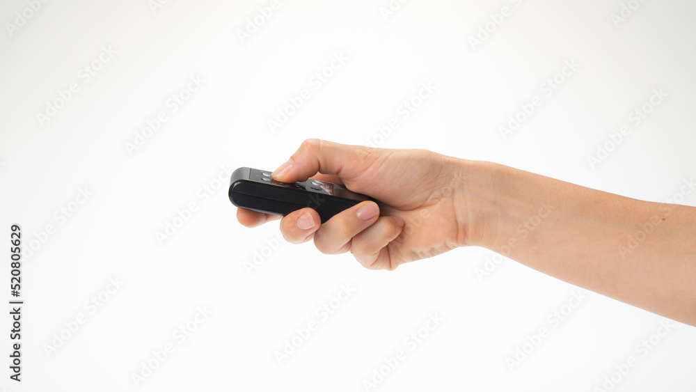 Right female hand horizontally holds the remote control Right female hand horizontally holds the remote control