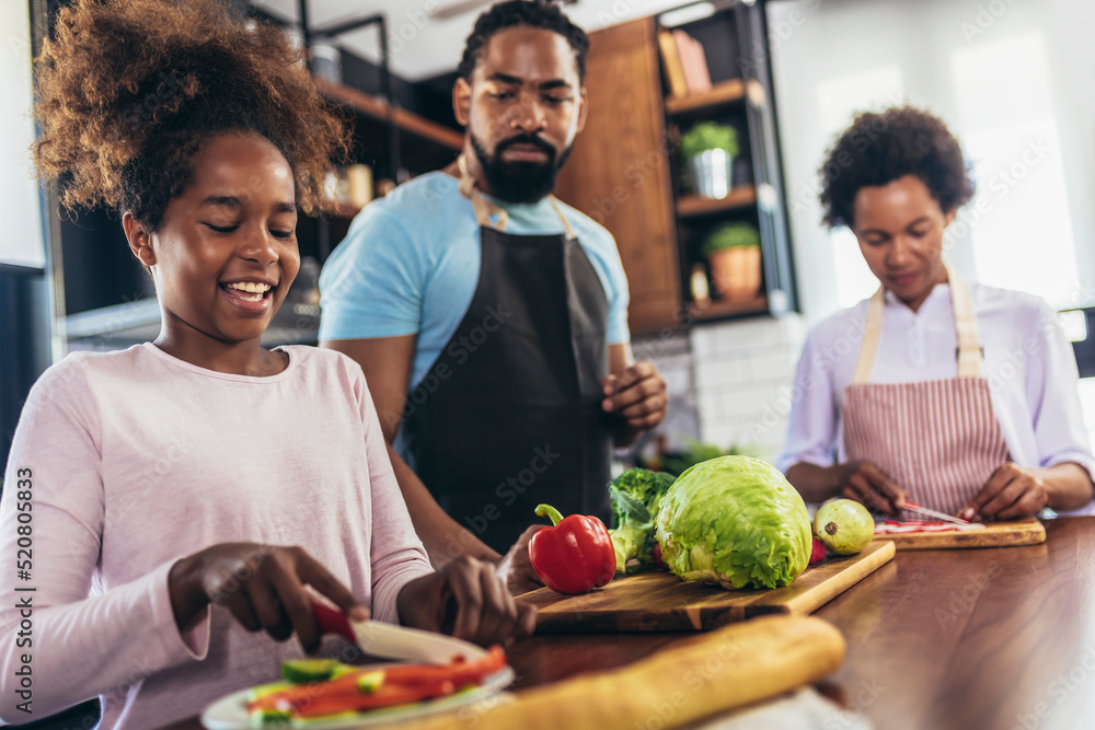 Fototapeta premium Happy multigenerational african american family make dinner together.
