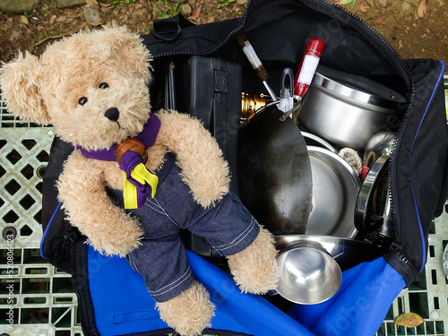 Scout bear and a bag of cookwares.                   photo