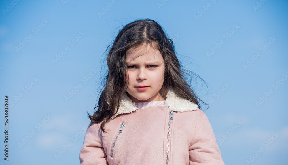 portrait of child with face on sky background