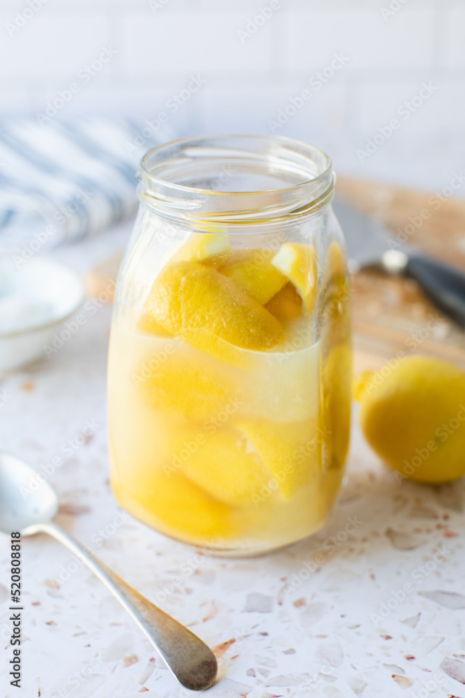 Making preserved Moroccan lemon with lemons and salt. Making preserved Moroccan lemon with lemons and salt.