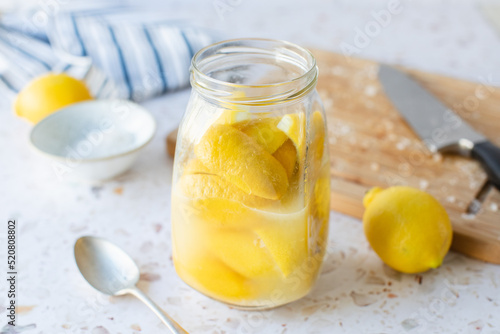 Making preserved Moroccan lemon with lemons and salt.