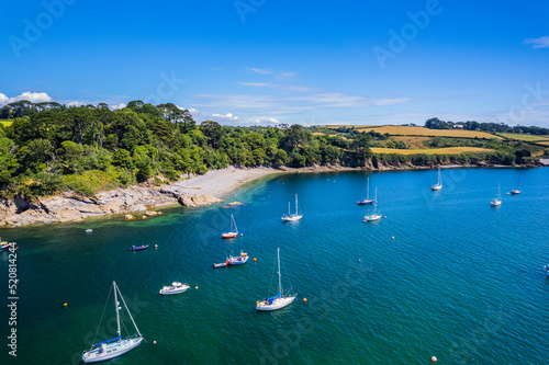 Aerial shot of Helford River with boats on summer day photo