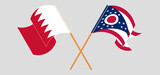 Crossed and waving flags of Bahrain and the State of Ohio