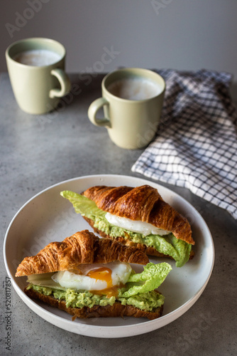 coffee and croissants with poached egg