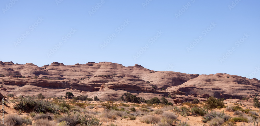 Desert Rocky Mountain American Landscape. Sunny Blue Sky Day. Oljato-Monument Valley, Arizona, United States. Nature Background