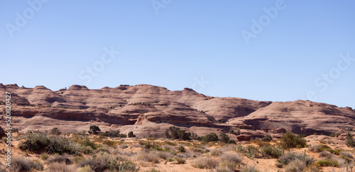 Desert Rocky Mountain American Landscape. Sunny Blue Sky Day. Oljato-Monument Valley  Arizona  United States. Nature Background