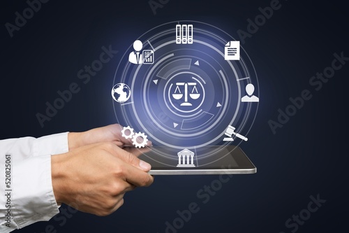 Justice and law concept. Lawyer business hands using innovation network icons on blue blurred background.