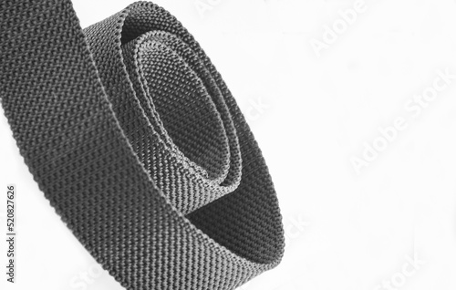 gray coarse textured nylon fabric belt roll with copy space or negative space