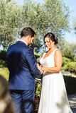 Groom and bride exchanging rings during their wedding