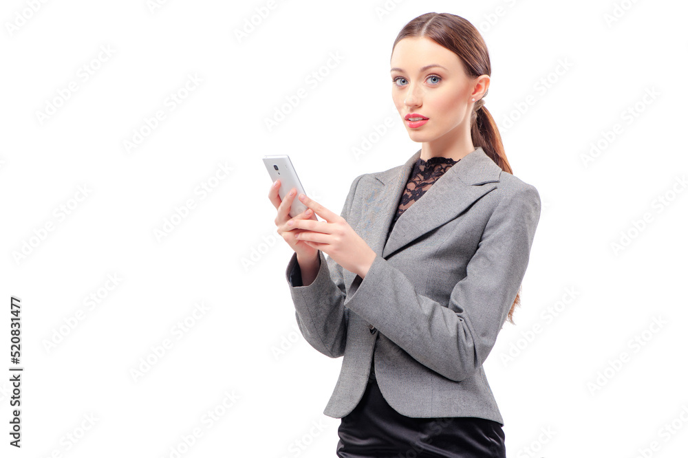 Business lady with mobile phone. Cheerful young caucasian woman in formal wear holding mobile phone and smiling while standing isolated on white Business lady with mobile phone. Cheerful young caucasian woman in formal wear holding mobile phone and smiling while standing isolated on white