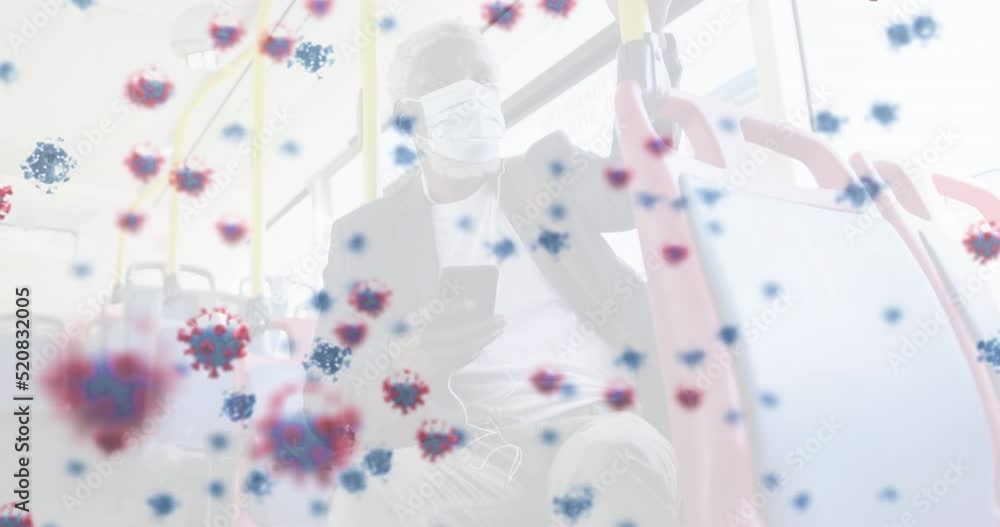Animation of falling covid 19 cells over caucasian man wearing face mask Animation of falling covid 19 cells over caucasian man wearing face mask