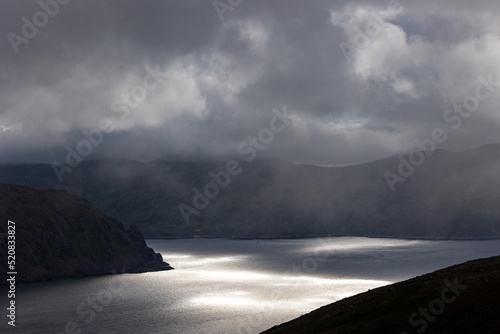 beautiful sunbeams in a Norwegian fjord. Dramatic sky over the mountains of Norway