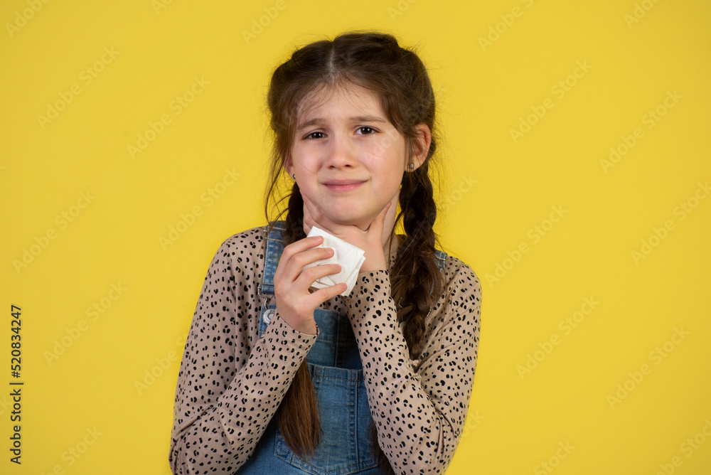 Little girl with sore throat touching her neck.Sore throat sick.Little