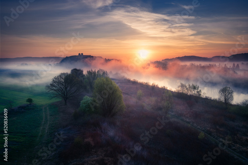 A monastery in Tyniec during the foggy sunrise. This Benedictine abbey is located close to Kraków city in Poland.