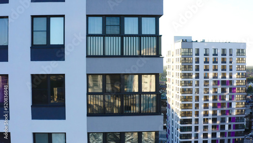 Top view of residential windows of modern house. Stock footage. Beautiful reflection of windows of modern residential building. Modern architecture design of residential building
