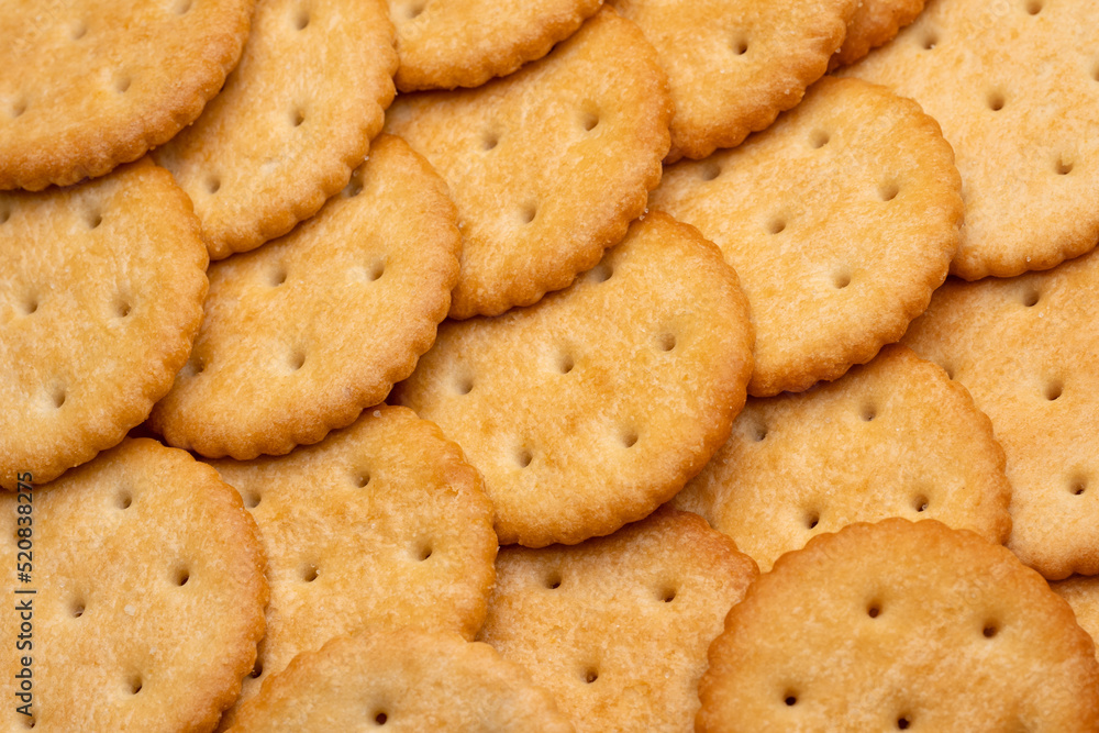 Healthy whole wheat cracker on white background. Stack of Saltine crackers isolated on white background. Round crackers. Healthy whole wheat cracker on white background. Stack of Saltine crackers isolated on white background. Round crackers.
