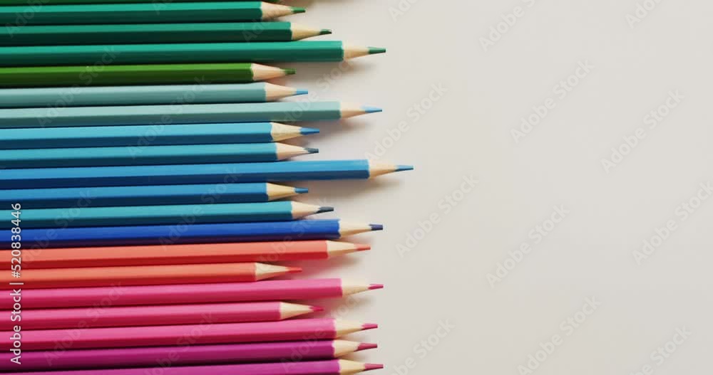 Video of composition with colorful crayons on pink surface with copy space Video of composition with colorful crayons on pink surface with copy space