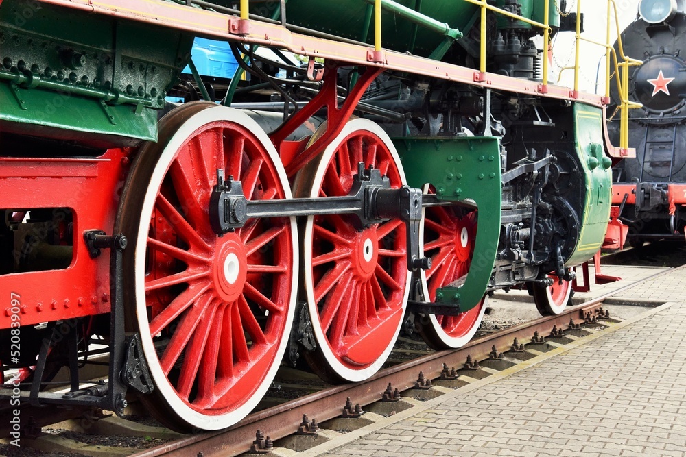 photo on the big wheels of an old train photo on the big wheels of an old train