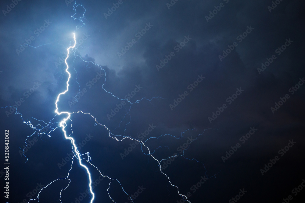 Fork lightning striking down during summer storm - obrazy, fototapety, plakaty 