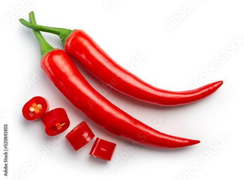 Chili pepper isolated. Chilli top view on white background. Whole and cut red hot chili peppers top. With clipping path. photo