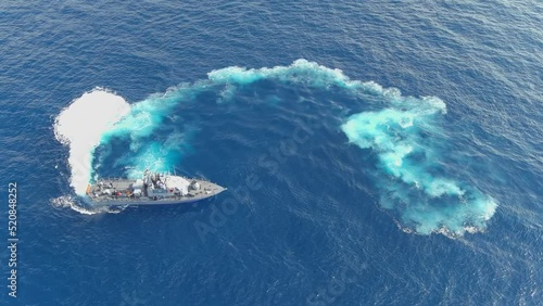 Navy vessel Perform maneuver Exercise in the sea with trails, aerial
The Dabur class is a class of patrol boats built in the United States for the Israeli Navy, 2022, drone view

 photo