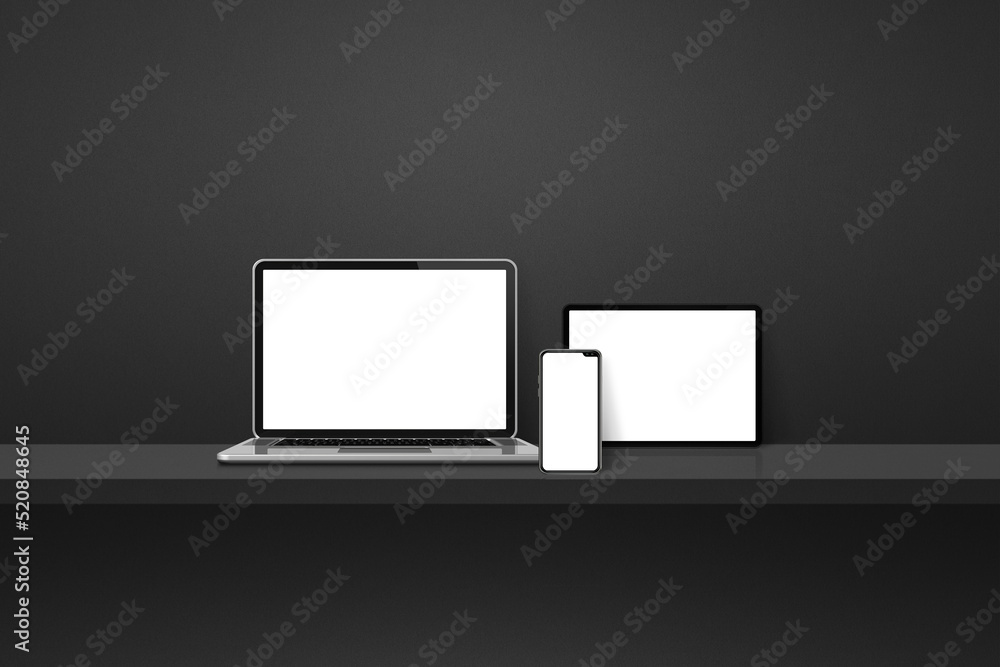 Laptop, mobile phone and digital tablet pc on black wall shelf. Horizontal background Laptop, mobile phone and digital tablet pc on black wall shelf. Horizontal background