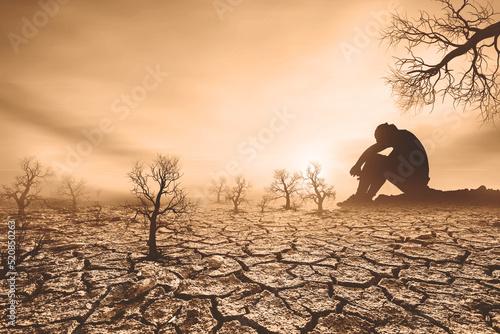 concept of global warming and drought People sat mourning over the drought. A world without water and food shortages. water and food crisis
