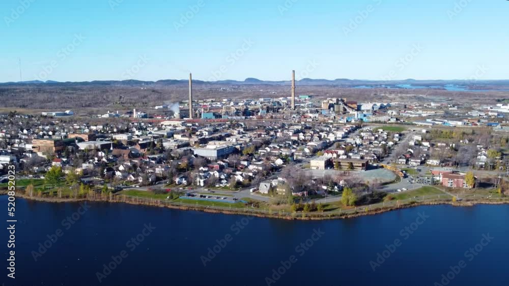 Aerial view of Rouyn-Noranda City foundry factory and Osisko Lake in a fall season sunny day. Abitibi-Temiscamingue, Quebec, Canada. Aerial view of Rouyn-Noranda City foundry factory and Osisko Lake in a fall season sunny day. Abitibi-Temiscamingue, Quebec, Canada.