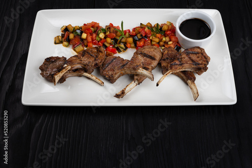Roasted lamb ribs with vege...