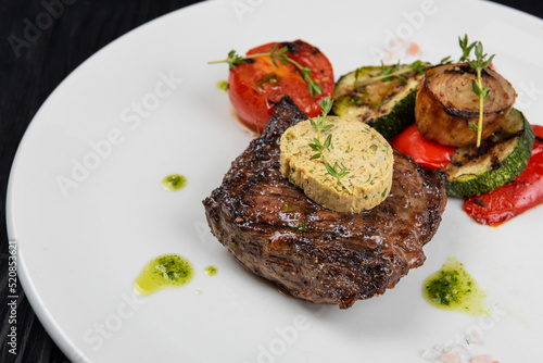 Grilled black angus strip loin steak with vegetables