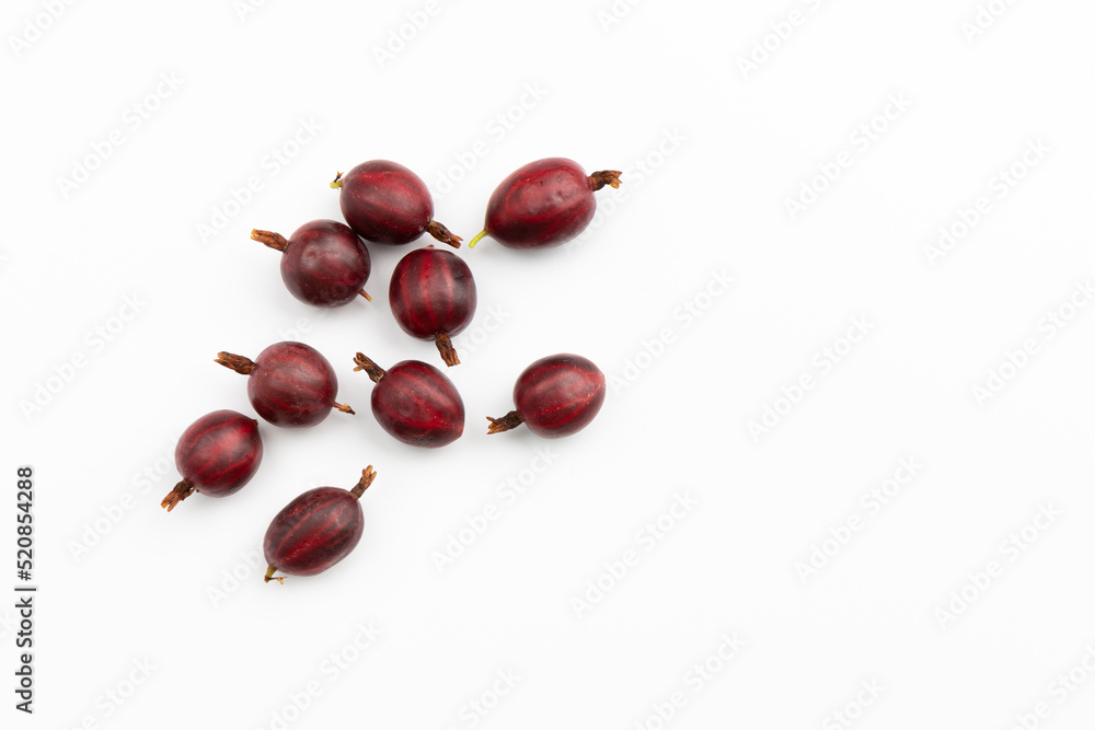Obraz premium pile of fresh red gooseberry isolated on white, top view