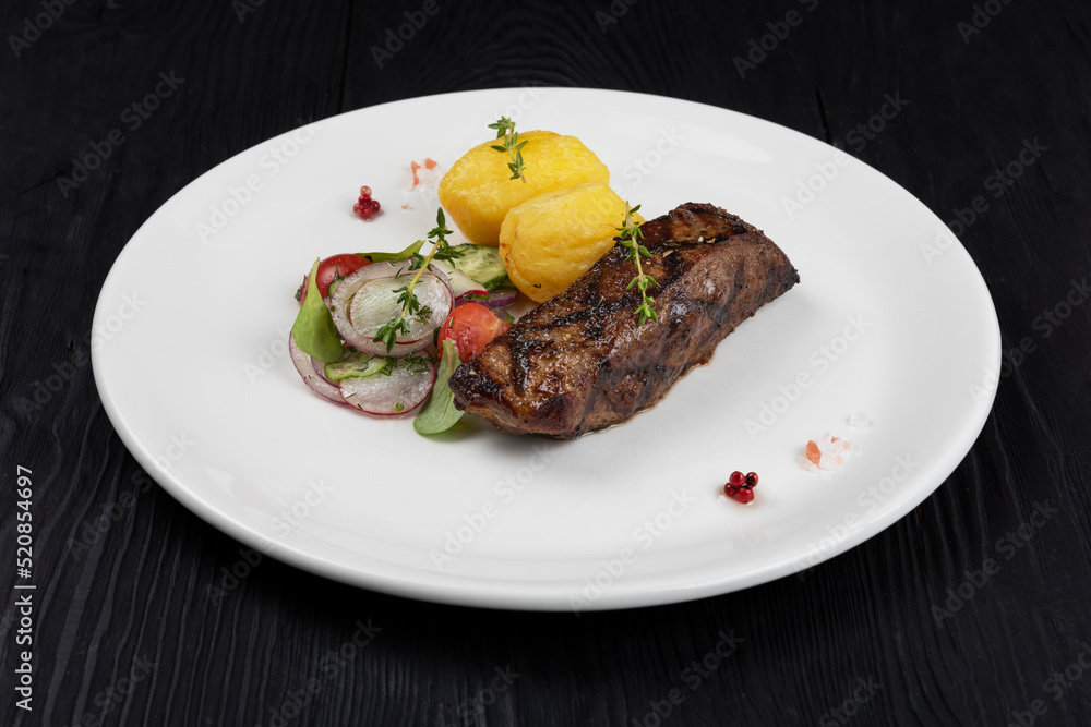 Grilled black angus strip loin steak with vegetables Grilled black angus strip loin steak with vegetables