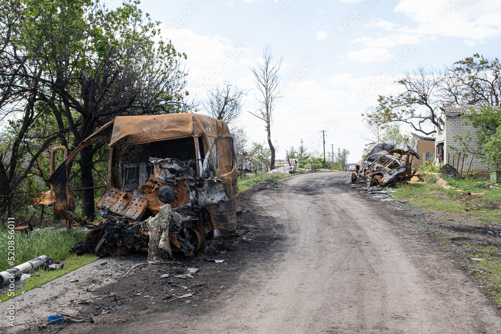 Burned and broken car. War in Ukraine 2022. Russian missiles in Kharkiv Ukraine. Russian aggression, conflict. Russian attack on Ukraine. 