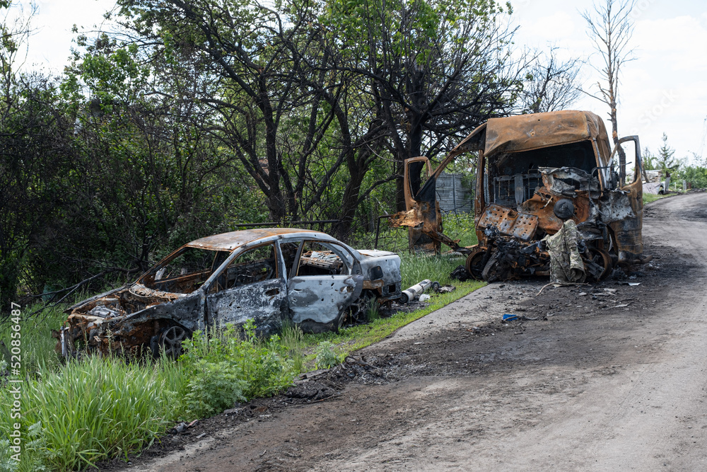 Burned and broken cars. War in Ukraine 2022. Russian missiles in Kharkiv Ukraine. Russian aggression, conflict. Russian attack on Ukraine. Burned and broken cars. War in Ukraine 2022. Russian missiles in Kharkiv Ukraine. Russian aggression, conflict. Russian attack on Ukraine.