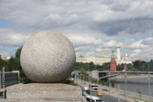 Granite ball against the background of the Moscow Kremlin, Moscow, July 2022, selective focus.