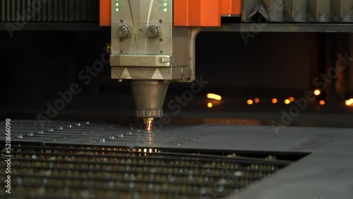 Timelapse video of CNC laser cutting machine.
The metal sheet is cut on the cnc machine and holes are drilled on it. Laser cutting device following laser light and laser light.  Cutting of industrial 
