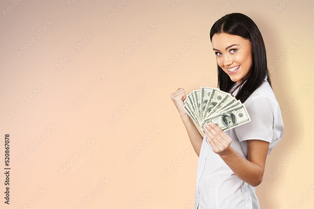Enthusiastic modern woman winning money, got cash, celebrating and shouting of joy, standing against background Enthusiastic modern woman winning money, got cash, celebrating and shouting of joy, standing against background