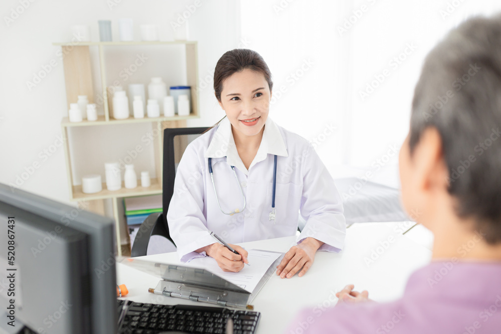 asian female doctor talk with old patient in mental health clinic, she screening and write patient information on patient chart, elderly healthcare promotion asian female doctor talk with old patient in mental health clinic, she screening and write patient information on patient chart, elderly healthcare promotion