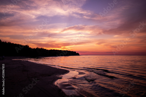 Fototapeta Naklejka Na Ścianę i Meble -  Warm sunset light on the seashore