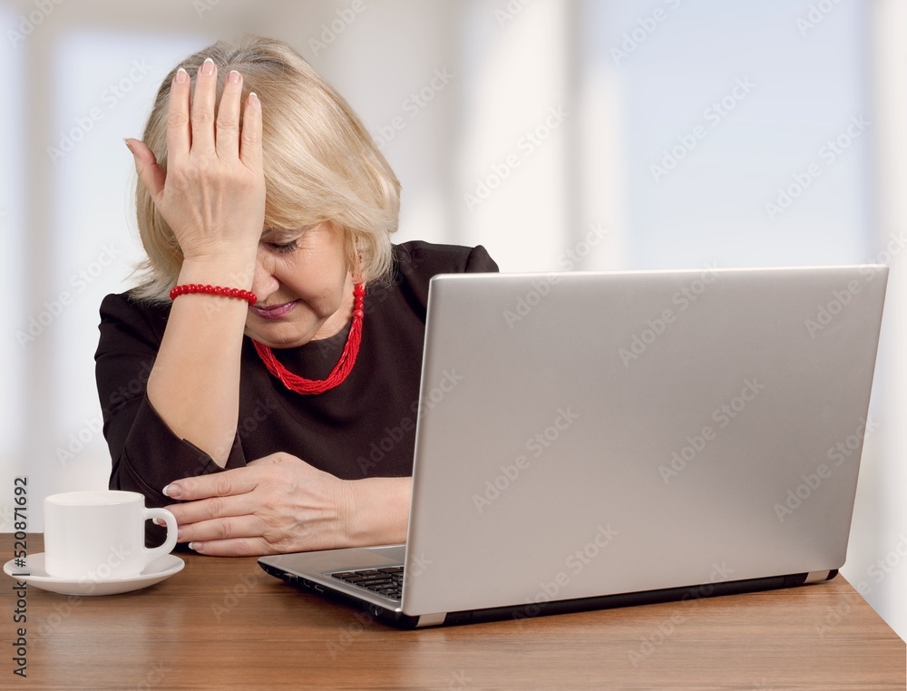 A person are stressed while working on laptop, Tired with headache at office, feeling sick at work A person are stressed while working on laptop, Tired with headache at office, feeling sick at work