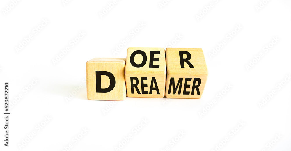Doer or dreamer symbol. Concept words Doer or dreamer on wooden cubes. Beautiful white table white background. Business and doer or dreamer concept. Copy space. Doer or dreamer symbol. Concept words Doer or dreamer on wooden cubes. Beautiful white table white background. Business and doer or dreamer concept. Copy space.
