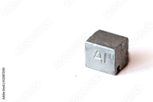 Aluminium cube with element name Al on it on white background