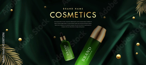 Set of Luxury Cosmetics on Green Silk Background