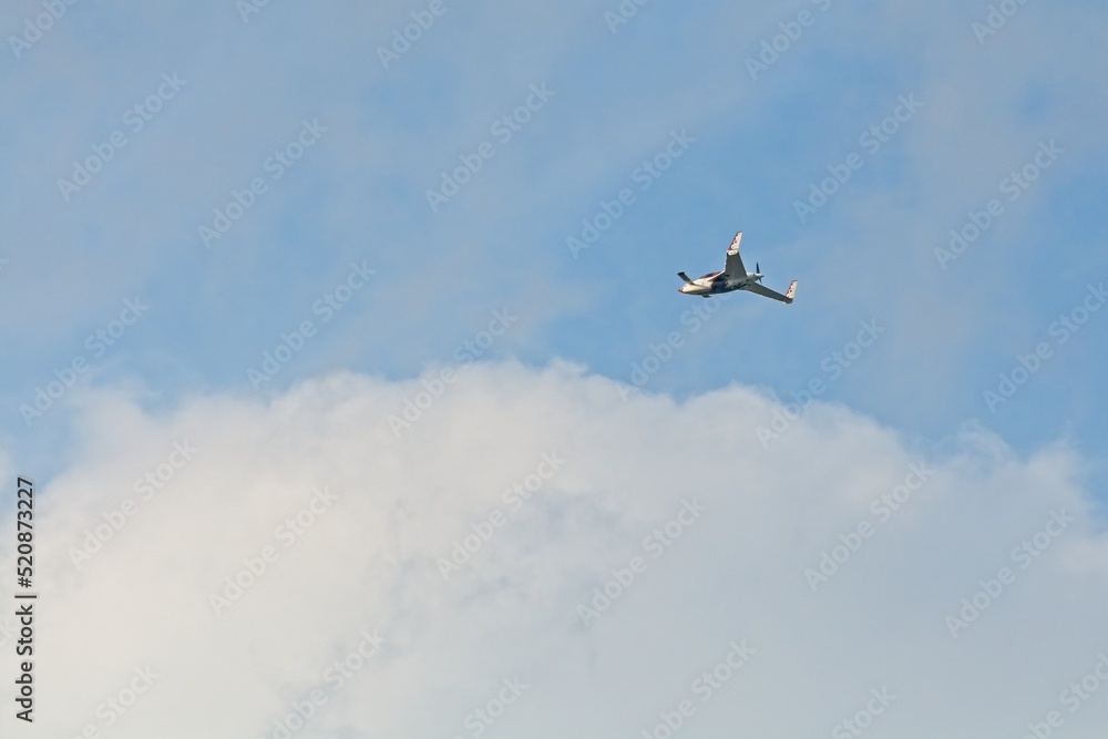 Canard aircraft with pusher engine flying overhead Canard aircraft with pusher engine flying overhead