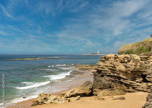 Cape Trafalgar as seen from Ca?os de Meca, southern Spain. Cloudy sky, turquoise sea, vacation, summer, tranquility.