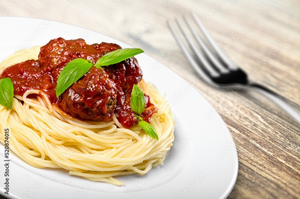 Classic Italian Pasta Spaghetti with wooden table background. Simple and easy vegetarian dish. Classic Italian Pasta Spaghetti with wooden table background. Simple and easy vegetarian dish.