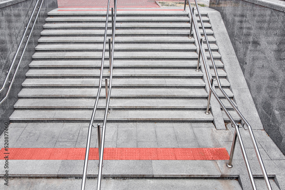 gray granite staircase with steps and stainless steel iron railings ...
