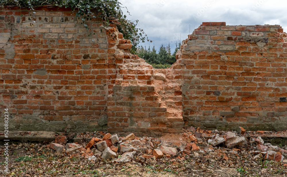 Brick wall destroyed by the storm 