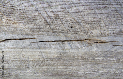 Wooden background - dark cracked wood.